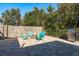 Relaxing backyard patio with fire pit, seating, and grill at 29703 69Th N St, Clearwater, FL 33761