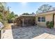 Backyard with screened porch and patio at 29703 69Th N St, Clearwater, FL 33761