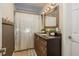 Bathroom with granite vanity, updated lighting, and shower at 29703 69Th N St, Clearwater, FL 33761