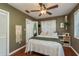 Cozy bedroom with hardwood floors and a ceiling fan at 29703 69Th N St, Clearwater, FL 33761