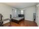 Bedroom with a bed, desk, and hardwood floor at 29703 69Th N St, Clearwater, FL 33761