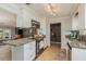 Open concept kitchen with granite counters, island, and stainless steel appliances at 29703 69Th N St, Clearwater, FL 33761