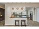 Kitchen boasts a breakfast bar with seating and granite countertops at 29703 69Th N St, Clearwater, FL 33761