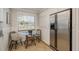 Kitchen features a breakfast nook and stainless steel refrigerator at 29703 69Th N St, Clearwater, FL 33761