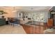 Living room with a large sectional sofa and access to a patio at 29703 69Th N St, Clearwater, FL 33761