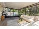 Relaxing screened porch with seating and plants at 29703 69Th N St, Clearwater, FL 33761