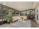 Spacious screened porch with comfy seating at 29703 69Th N St, Clearwater, FL 33761