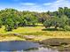 Serene lakeside view with wooden dock at 29850 Dan Brown Hill Rd, Dade City, FL 33523