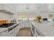 Bright white kitchen with stainless steel appliances at 29850 Dan Brown Hill Rd, Dade City, FL 33523