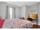 Bedroom with a desk workspace and hardwood floors at 3312 Francoa Dr, Odessa, FL 33556