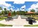 Two bocce ball courts with seating areas and umbrellas at 3312 Francoa Dr, Odessa, FL 33556