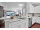 Modern kitchen with a large island and stainless steel appliances at 3312 Francoa Dr, Odessa, FL 33556