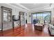 Bright living room featuring hardwood floors, recessed lighting, and sliding glass doors at 3312 Francoa Dr, Odessa, FL 33556