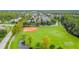 Aerial view of community park with baseball and soccer fields at 3481 Bumelia Ln, New Port Richey, FL 34655