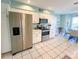 Stainless steel appliances and white cabinetry in this well-lit kitchen at 3520 51St W Ave, Bradenton, FL 34210