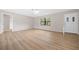 Light and airy living room featuring wood-look flooring at 359 Portland Ave, Spring Hill, FL 34606