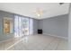 Bedroom with tile floors, window, and ceiling fan at 4151 Hillsdale Dr, New Port Richey, FL 34652