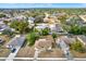 Aerial view of a residential neighborhood showcasing houses and surrounding landscape at 5461 Colchester Ave, Spring Hill, FL 34608