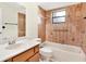 Clean bathroom with tub, shower, and vanity at 5461 Colchester Ave, Spring Hill, FL 34608