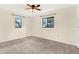 Bright bedroom with neutral walls and carpet at 5461 Colchester Ave, Spring Hill, FL 34608