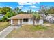 Single story home with attached garage and palm tree at 5461 Colchester Ave, Spring Hill, FL 34608