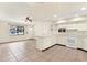 Kitchen boasts white cabinets, tile floors, and modern appliances at 5461 Colchester Ave, Spring Hill, FL 34608