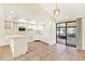 Kitchen with white cabinets, tile flooring, and a breakfast bar at 5461 Colchester Ave, Spring Hill, FL 34608