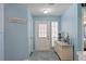 Light and airy entryway with a charming dresser and patterned rug at 6051 Port Rush Ct, Spring Hill, FL 34606