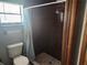 Bathroom with shower stall and toilet at 6141 Freeport Dr, Spring Hill, FL 34606