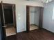 Bedroom with large closet and access to hallway at 6141 Freeport Dr, Spring Hill, FL 34606