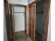 Bedroom with two large closets with bi-fold doors at 6141 Freeport Dr, Spring Hill, FL 34606