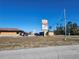 Exterior view of commercial building with parking and signage at 6141 Freeport Dr, Spring Hill, FL 34606