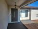 Dark brown front door with sidelight window at 6141 Freeport Dr, Spring Hill, FL 34606