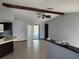 Spacious living room with tile floor and kitchen view at 6141 Freeport Dr, Spring Hill, FL 34606