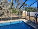 Refreshing blue pool with a screened enclosure at 6141 Freeport Dr, Spring Hill, FL 34606