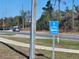 Image of a blue road sign with directions to Gateway Bible Church at 6141 Freeport Dr, Spring Hill, FL 34606