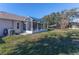 House with a large backyard and screened patio at 7425 Nature Walk Dr, Spring Hill, FL 34606