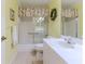 Clean bathroom with a shower/tub combo and a large vanity at 7425 Nature Walk Dr, Spring Hill, FL 34606