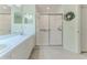 Clean bathroom with double sinks and a shower at 7425 Nature Walk Dr, Spring Hill, FL 34606