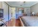 Bright bedroom with wood flooring and access to a bathroom at 7425 Nature Walk Dr, Spring Hill, FL 34606