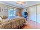 Bedroom featuring wood floors and plenty of natural light at 7425 Nature Walk Dr, Spring Hill, FL 34606