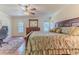 Main bedroom with a king-size bed and a ceiling fan at 7425 Nature Walk Dr, Spring Hill, FL 34606