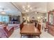 Open dining room with a view of the living room and kitchen at 7425 Nature Walk Dr, Spring Hill, FL 34606