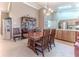 Bright dining area with a wood table and chairs near kitchen at 7425 Nature Walk Dr, Spring Hill, FL 34606