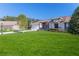 House with two-car garage and a lush green lawn at 7425 Nature Walk Dr, Spring Hill, FL 34606