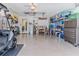 Spacious garage with ample storage; Golf cart and shelving at 7425 Nature Walk Dr, Spring Hill, FL 34606