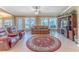 Bright Gathering room features a cozy seating area and large windows at 7425 Nature Walk Dr, Spring Hill, FL 34606