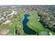 Aerial view showing a beautiful golf course with water features at 7425 Nature Walk Dr, Spring Hill, FL 34606