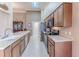 Modern kitchen with stainless steel appliances and light wood cabinets at 7425 Nature Walk Dr, Spring Hill, FL 34606