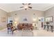 Living room with vaulted ceilings, tile floors, and comfortable seating at 7425 Nature Walk Dr, Spring Hill, FL 34606